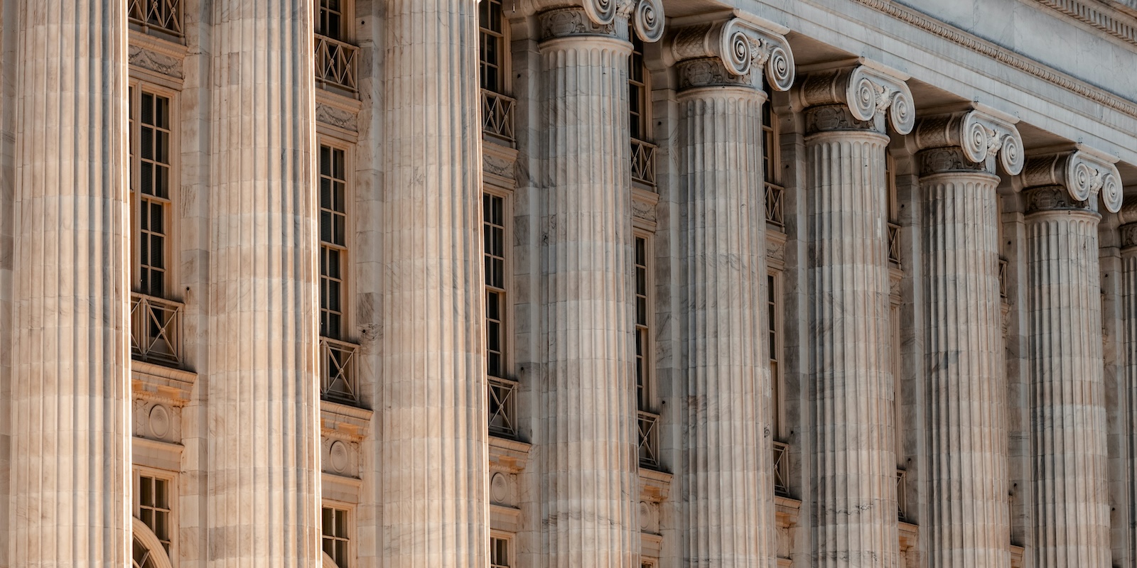 A photo of a courthouse facade with columns.